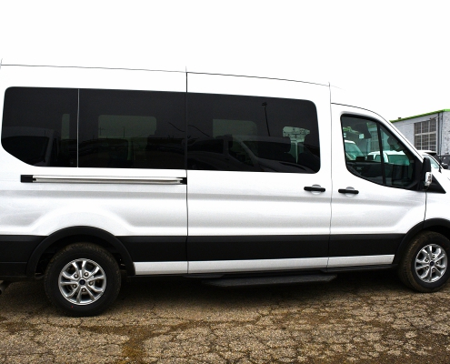 Exterior of white 15-passenger van